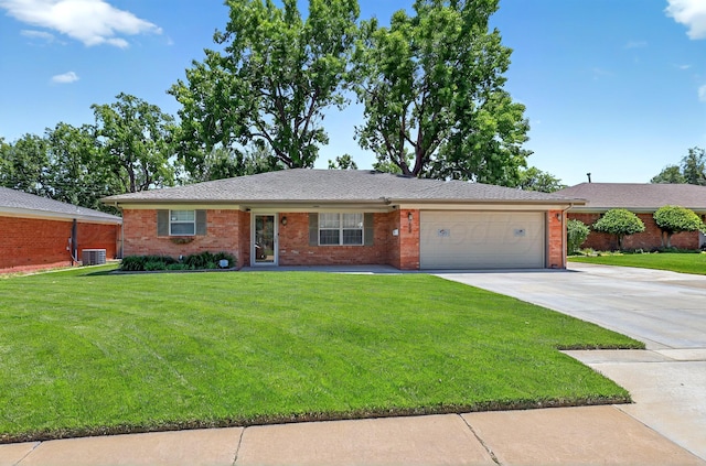 single story home with a garage, a front lawn, concrete driveway, and brick siding