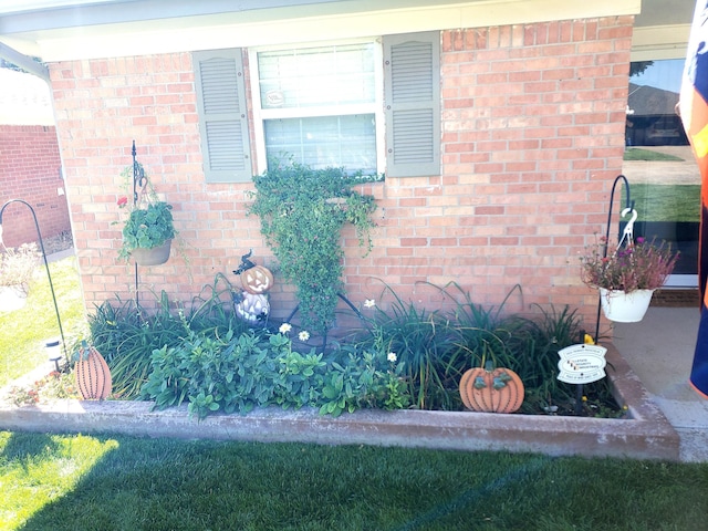 property entrance with brick siding