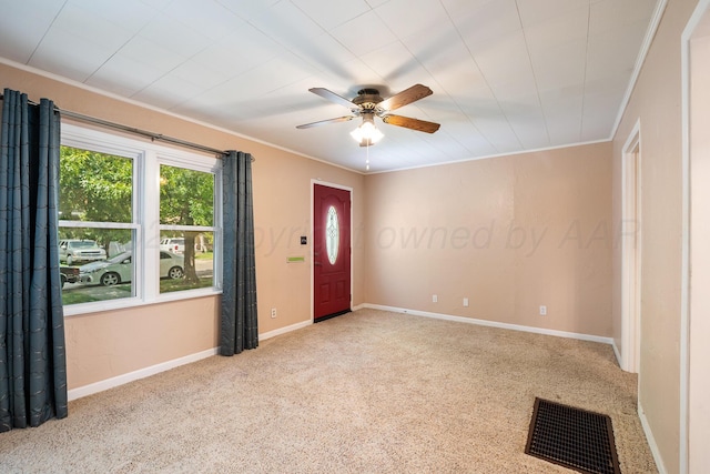 2804 Rule St, Amarillo, TX 79107 - foyer with a ceiling fan, ornamental molding, carpet flooring, and baseboards