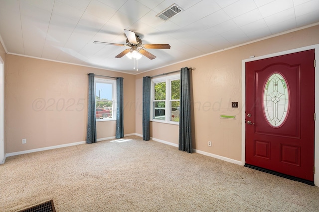 2804 Rule St, Amarillo, TX 79107 - carpeted entryway with a ceiling fan, ornamental molding, and baseboards