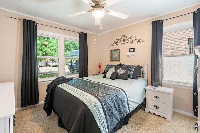 2804 Rule St, Amarillo, TX 79107 - bedroom with light colored carpet, crown molding, ceiling fan, and baseboards