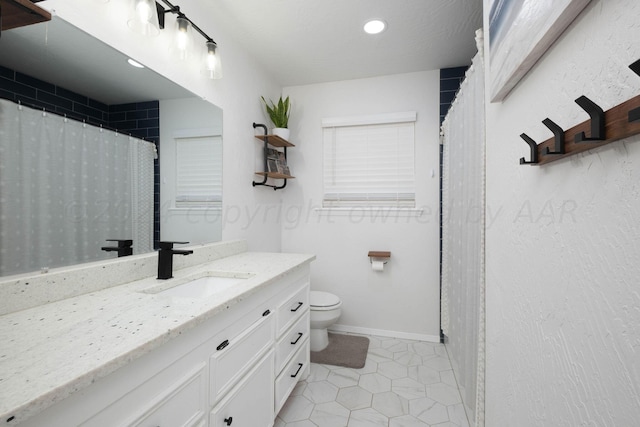 bathroom featuring a shower with curtain, tile patterned flooring, vanity, and toilet