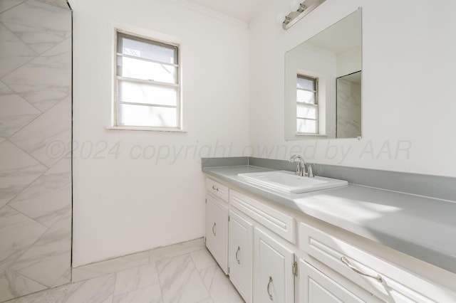 bathroom featuring ornamental molding and vanity