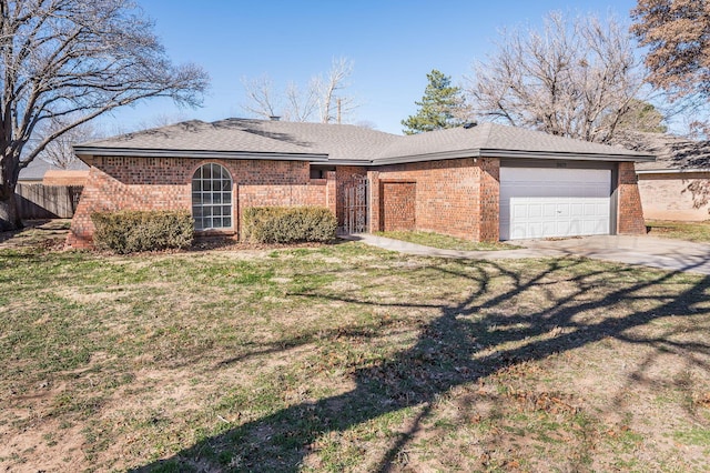 ranch-style home with a garage and a front yard