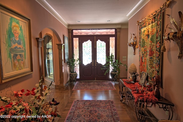 foyer featuring french doors and hardwood / wood-style floors