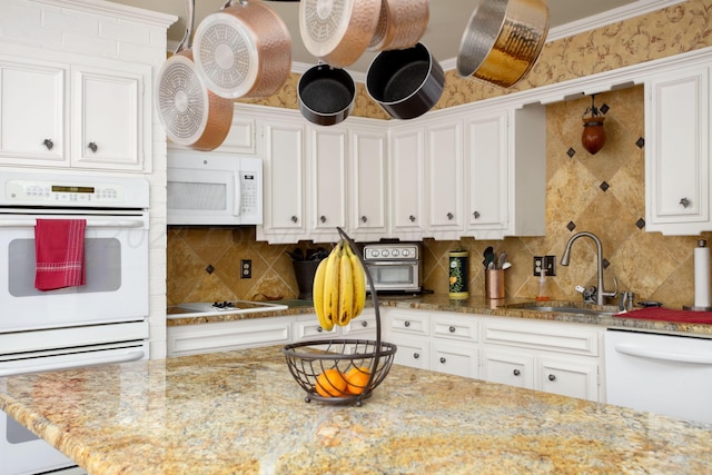 3 Nottingham Rd, Amarillo, TX 79124 - kitchen featuring white appliances, a sink, white cabinets, and tasteful backsplash