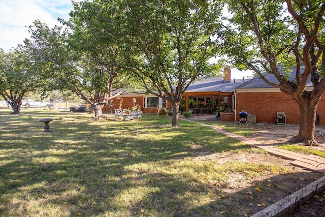 3 Nottingham Rd, Amarillo, TX 79124 - view of grassy yard featuring a patio