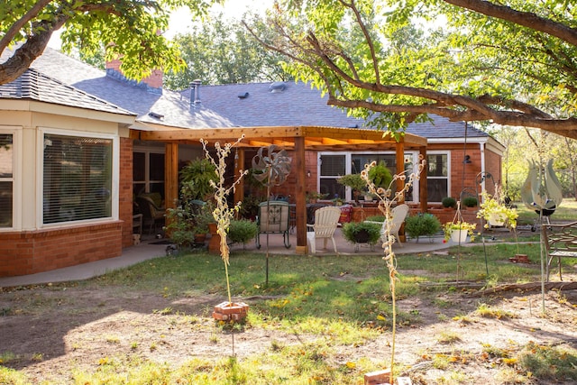 3 Nottingham Rd, Amarillo, TX 79124 - rear view of house featuring a patio, brick siding, a shingled roof, and a chimney