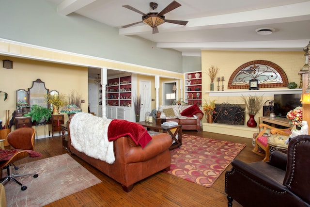 3 Nottingham Rd, Amarillo, TX 79124 - living room featuring beam ceiling, ceiling fan, wood finished floors, and a fireplace with raised hearth
