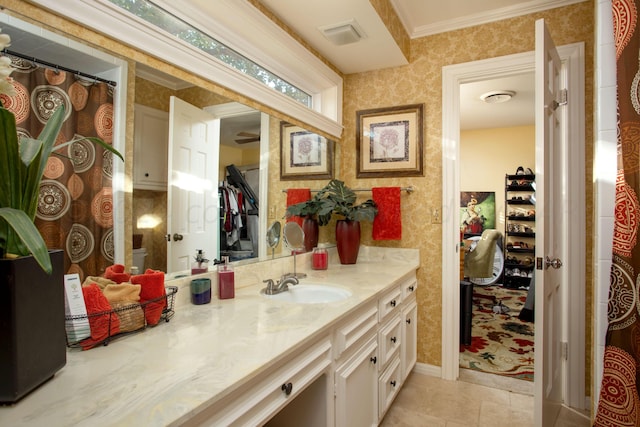 3 Nottingham Rd, Amarillo, TX 79124 - bathroom with wallpapered walls, vanity, tile patterned flooring, crown molding, and baseboards
