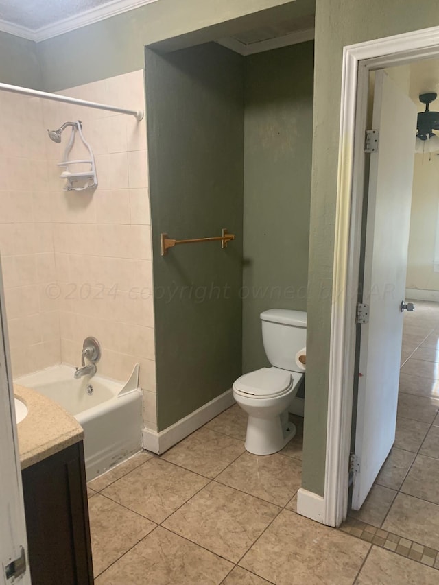 full bathroom featuring tiled shower / bath combo, tile patterned flooring, vanity, toilet, and ornamental molding