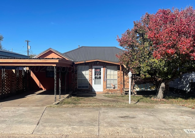 view of front of home with a carport