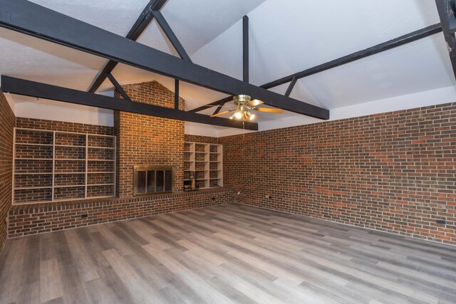 2709 Mohawk Dr, Amarillo, TX 79109 - unfurnished living room with brick wall, high vaulted ceiling, wood finished floors, ceiling fan, and beamed ceiling