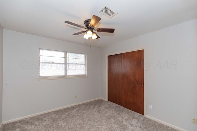 2709 Mohawk Dr, Amarillo, TX 79109 - unfurnished bedroom featuring carpet, a closet, baseboards, and a ceiling fan
