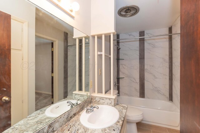 2709 Mohawk Dr, Amarillo, TX 79109 - bathroom with toilet, washtub / shower combination, and vanity