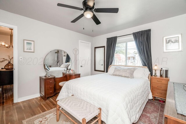 bedroom featuring ceiling fan and wood-type flooring