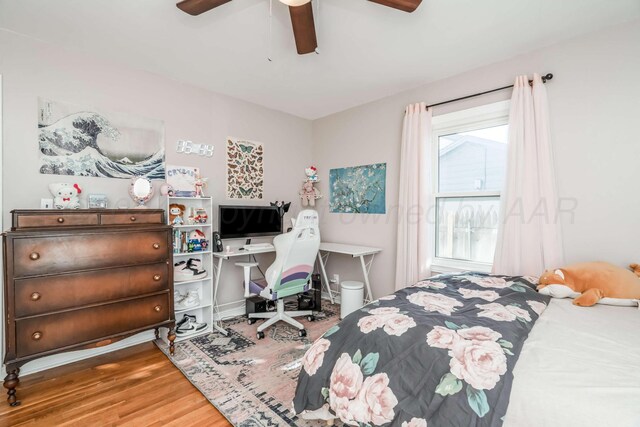 bedroom featuring hardwood / wood-style flooring and ceiling fan