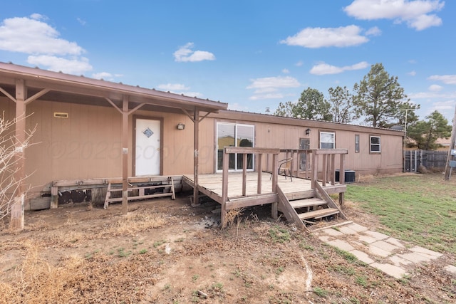 view of front of house featuring fence and a wooden deck