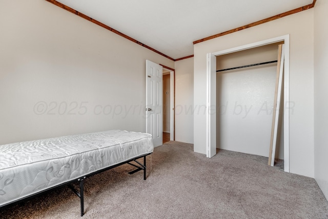 carpeted bedroom featuring crown molding