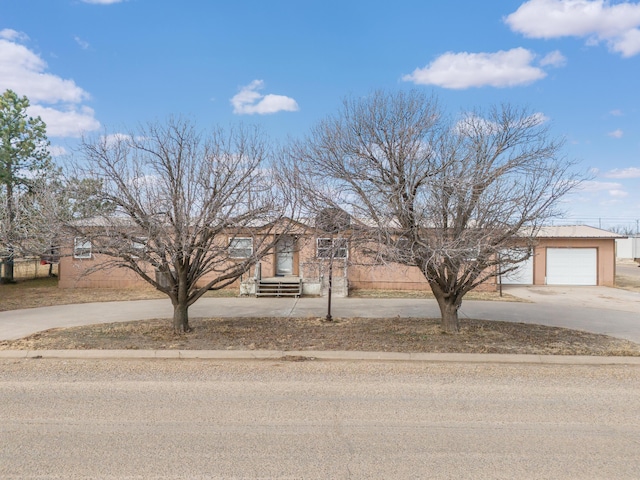 view of front of home featuring driveway and an attached garage