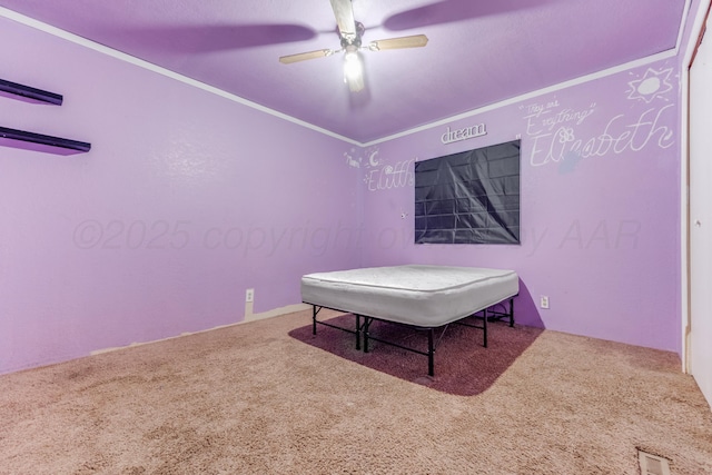 interior space featuring carpet floors, a ceiling fan, visible vents, and crown molding