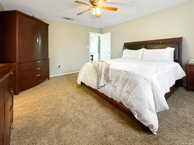 1620 Takewell St, Borger, TX 79007 - carpeted bedroom with a textured ceiling, ceiling fan, and baseboards