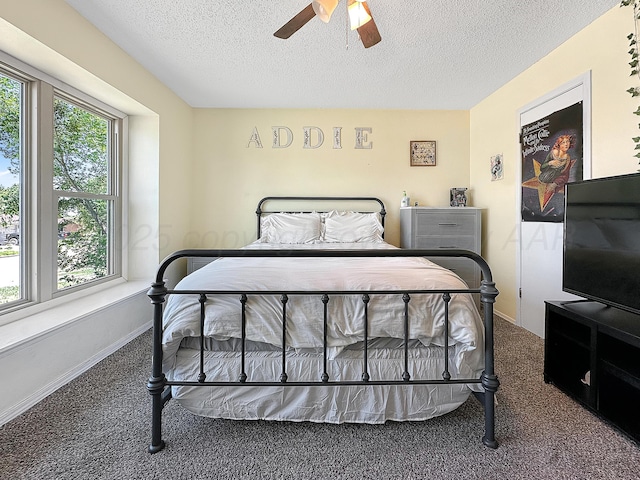 1620 Takewell St, Borger, TX 79007 - bedroom with carpet floors, a textured ceiling, a ceiling fan, and baseboards