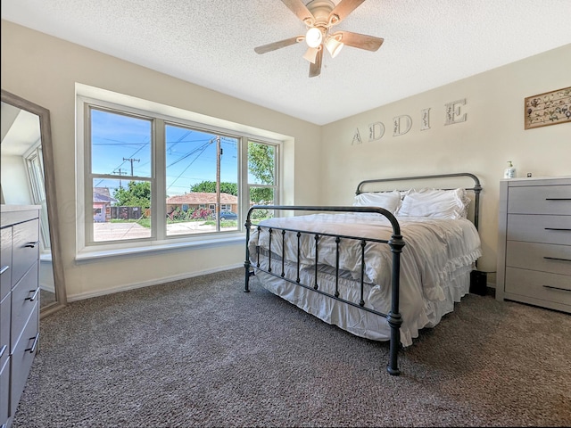 1620 Takewell St, Borger, TX 79007 - carpeted bedroom with a textured ceiling, baseboards, and a ceiling fan