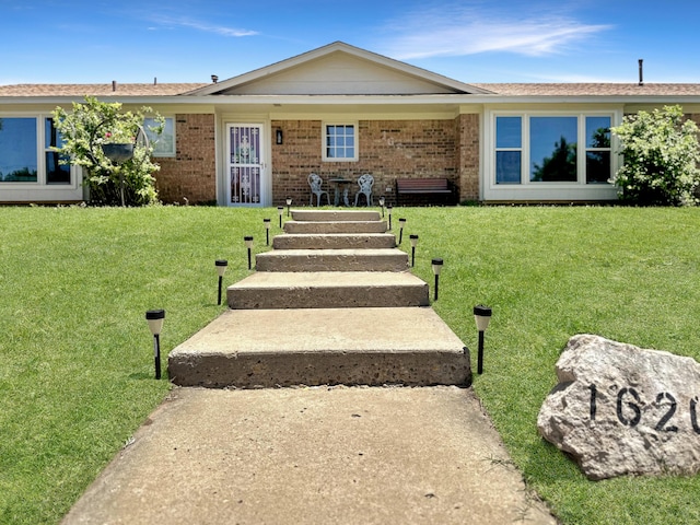 1620 Takewell St, Borger, TX 79007 - single story home with a front yard and brick siding