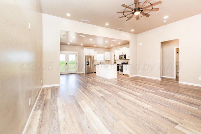 30 Country Club Dr, Farwell, TX 79325 - unfurnished living room featuring a ceiling fan, recessed lighting, baseboards, visible vents, and light wood-style floors