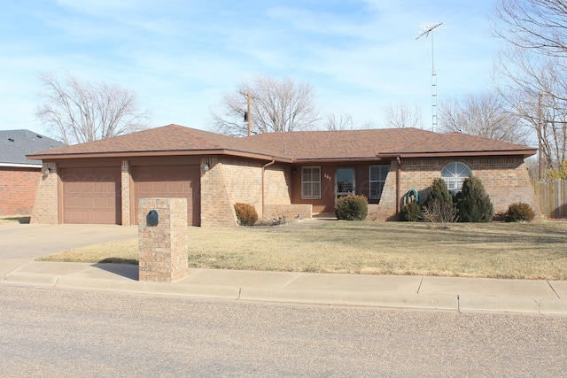 single story home with a garage and a front lawn