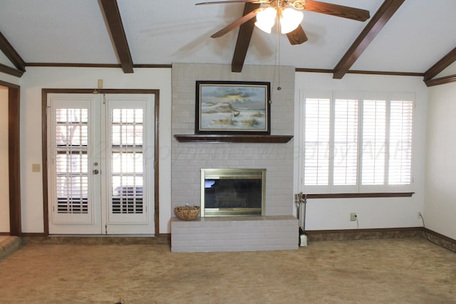 unfurnished living room with lofted ceiling with beams, carpet, french doors, and a brick fireplace