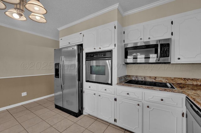kitchen featuring white cabinets, light tile patterned floors, a textured ceiling, and appliances with stainless steel finishes