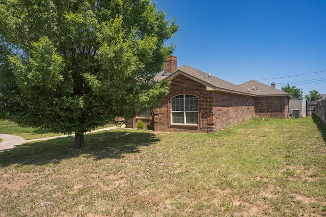 1800 Berkley Ct, Amarillo, TX 79118 - view of side of property with brick siding and a chimney