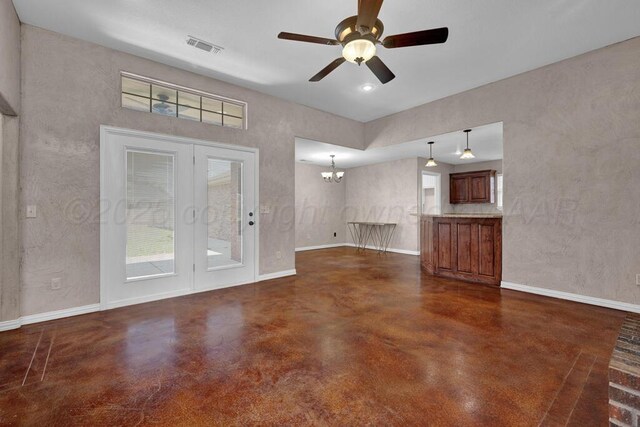 1800 Berkley Ct, Amarillo, TX 79118 - unfurnished living room with finished concrete floors, a ceiling fan, and a chandelier