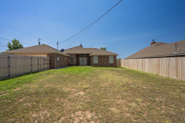 1800 Berkley Ct, Amarillo, TX 79118 - back of property featuring a fenced backyard and brick siding