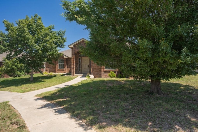 1800 Berkley Ct, Amarillo, TX 79118 - view of property hidden behind natural elements with a front yard and brick siding