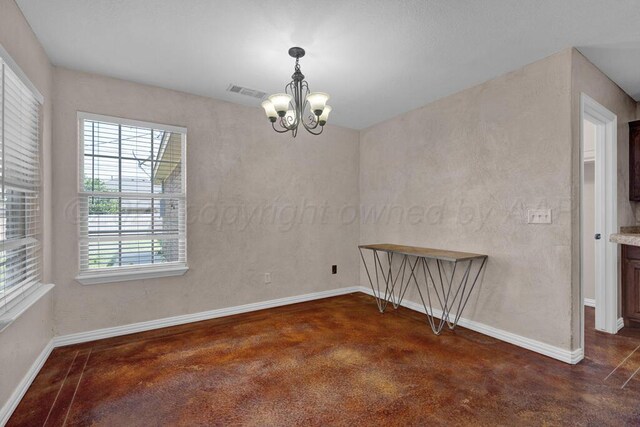 1800 Berkley Ct, Amarillo, TX 79118 - unfurnished room featuring a chandelier and concrete flooring