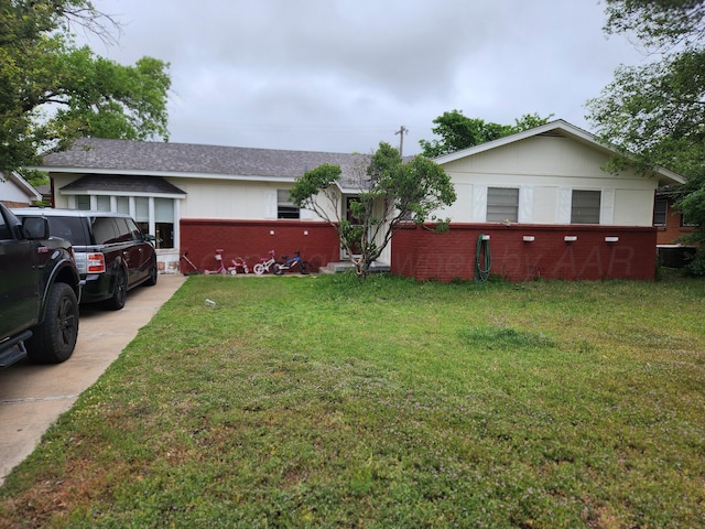2608 Duncan Dr, Amarillo, TX 79109 - view of grassy yard featuring driveway