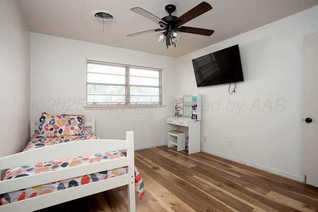 3607 Julie Dr, Amarillo, TX 79109 - bedroom featuring light wood-style floors, baseboards, and ceiling fan