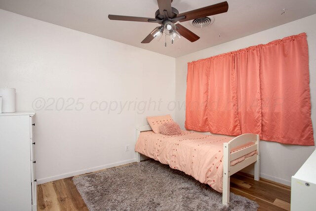3607 Julie Dr, Amarillo, TX 79109 - bedroom featuring wood finished floors, baseboards, and ceiling fan