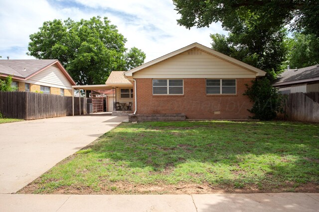 3607 Julie Dr, Amarillo, TX 79109 - view of front of home with brick siding, driveway, an attached carport, and crawl space