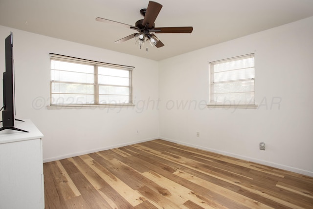 3607 Julie Dr, Amarillo, TX 79109 - unfurnished room with light wood-type flooring, plenty of natural light, ceiling fan, and baseboards