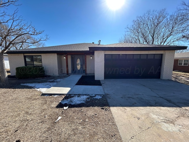 single story home with a garage