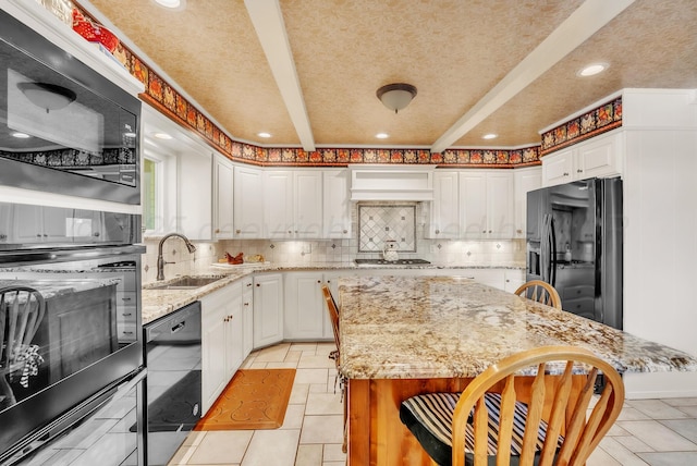 3465 Fm 1058, Hereford, TX 79045 - kitchen featuring black appliances, a sink, white cabinets, decorative backsplash, and light tile patterned floors