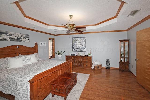 3508 Reeder Dr, Amarillo, TX 79121 - bedroom with a raised ceiling, light wood-type flooring, ornamental molding, and visible vents