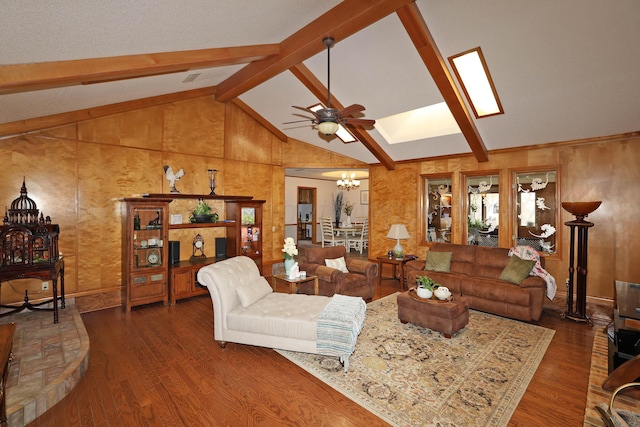 3508 Reeder Dr, Amarillo, TX 79121 - living room with wood finished floors, ceiling fan with notable chandelier, and lofted ceiling with skylight