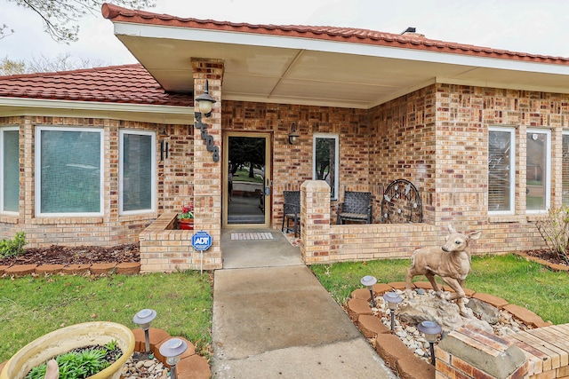 3508 Reeder Dr, Amarillo, TX 79121 - entrance to property featuring brick siding and a tile roof