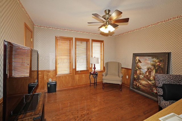 3508 Reeder Dr, Amarillo, TX 79121 - living area with wainscoting, wallpapered walls, a ceiling fan, and wood finished floors