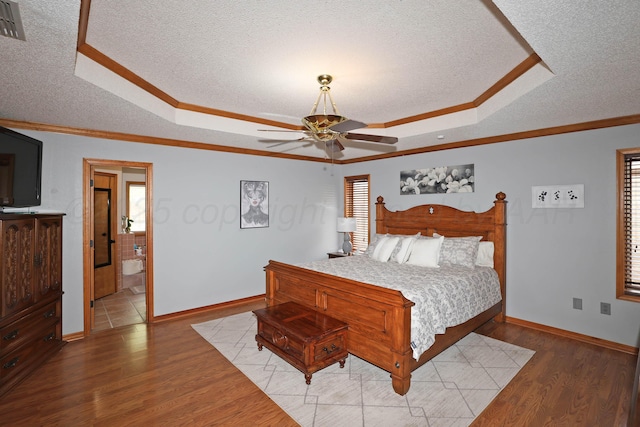 3508 Reeder Dr, Amarillo, TX 79121 - bedroom with light wood-type flooring, crown molding, and a raised ceiling